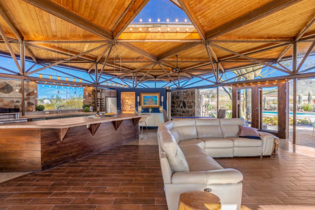 Great design - expansive living room constructed of metal, glass and wood. 
