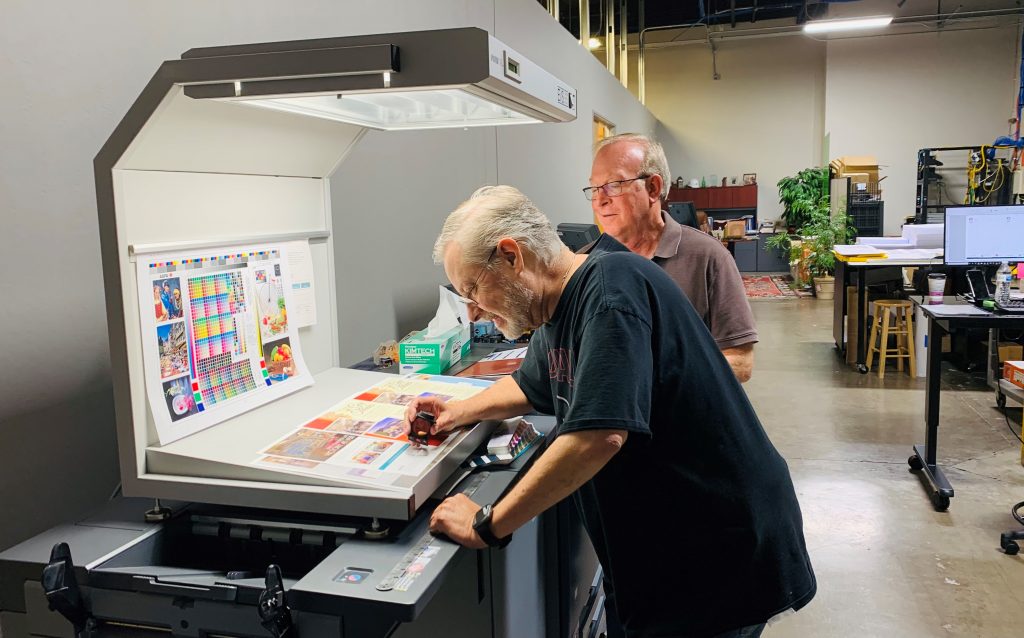 Bill Gelbaugh and Doug Ills in the Outhouse Printshop Verifying Color Calibrations