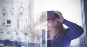 Woman taking Virtual home tour using VR glasses